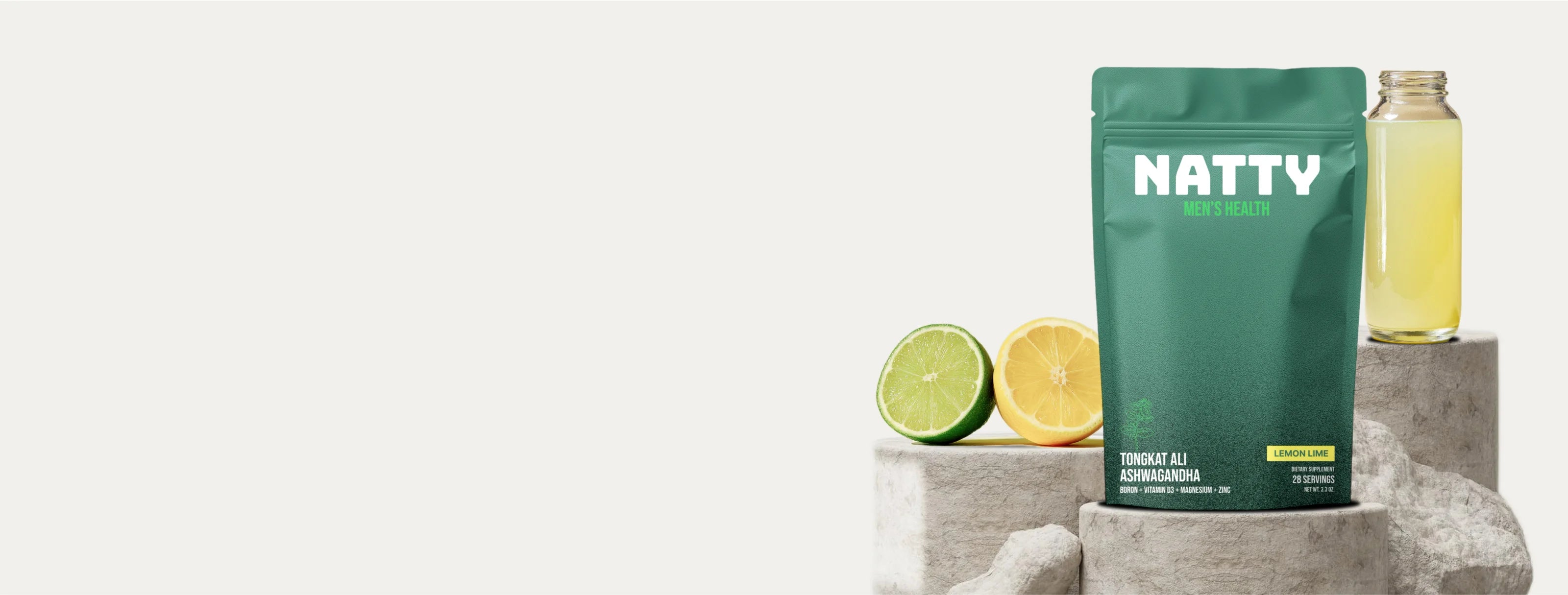 Green pouch of NATTY Men’s Health supplement next to a glass of green drink with lime and powder splash.